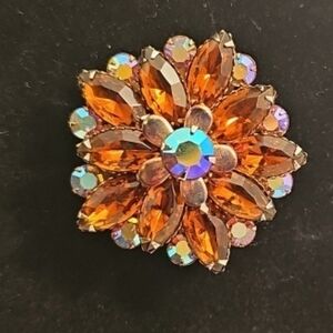 Radiant Floral Brooch with Orange and Gold Accents